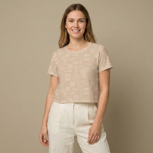 Woman wearing the Vibewear 'Coastal Daydream' relaxed crop tee