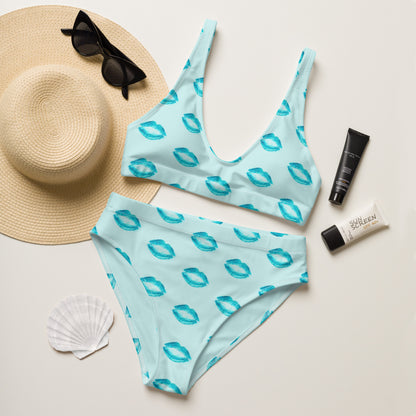Ocean Kiss recycled high waisted bikini laid flat with summer accessories