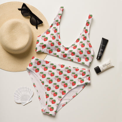 Berry Blush recycled high waisted bikini laid flat with summer accessories