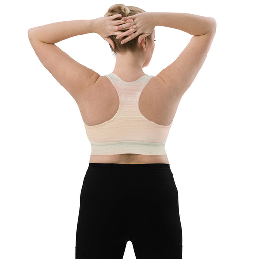 Back view of model wearing Focused recycled longline sports bra with racerback design