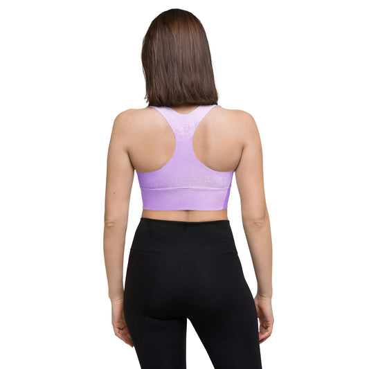 Back view of model wearing Do It For You recycled longline sports bra with racerback design
