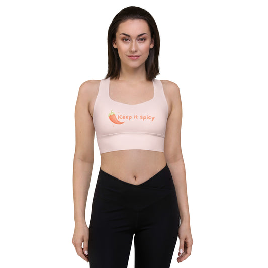 Model wearing Keep It Spicy recycled longline sports bra with slogan print front view