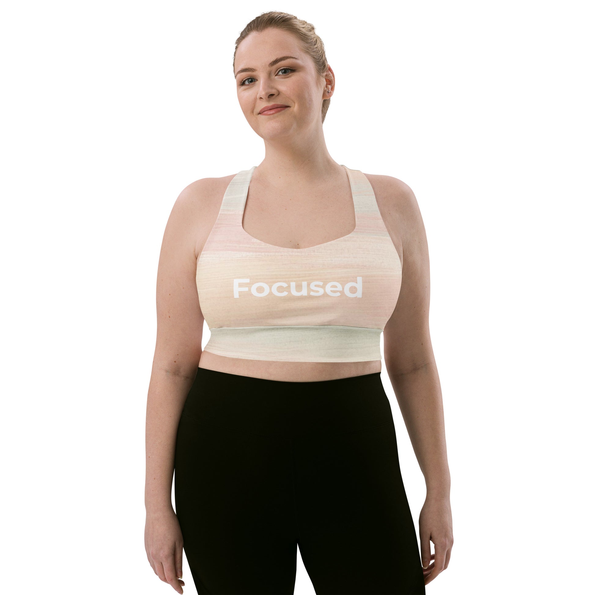 Model wearing Focused recycled longline sports bra in neutral tone front view