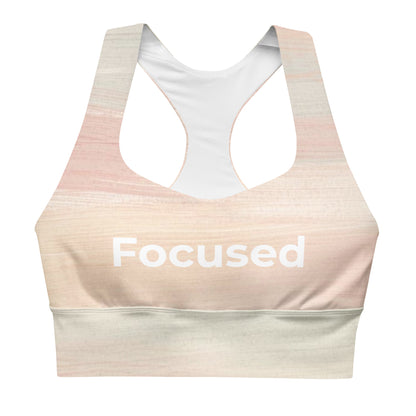 Focused recycled longline sports bra showing Focused text and wide support band