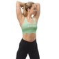 Model wearing Be Your Priority recycled longline sports bra in soft green front view