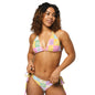 Model wearing Pastel Patchwork Splash recycled string bikini with adjustable tie sides