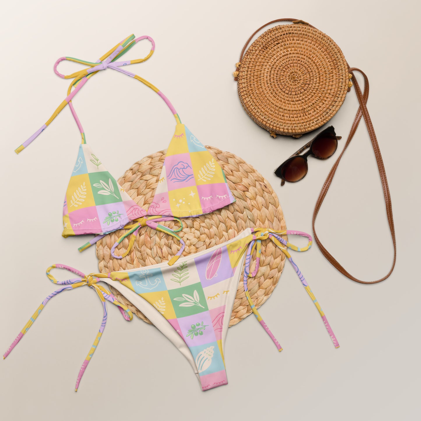 Pastel Patchwork Splash recycled string bikini laid flat showing pastel patchwork print