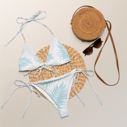 Palm Breeze recycled string bikini laid flat with summer accessories