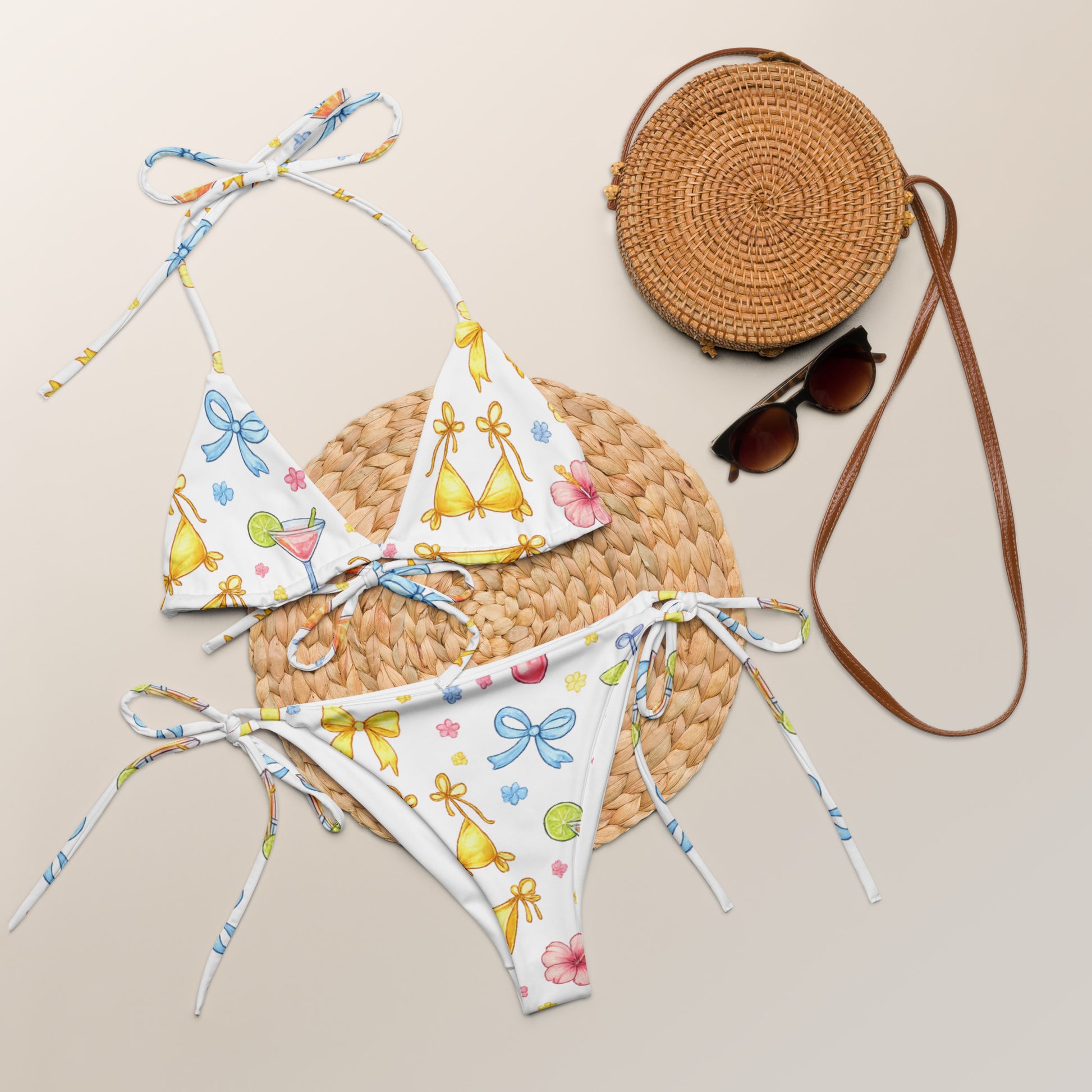 Summer Spritz recycled string bikini set laid flat with summer accessories