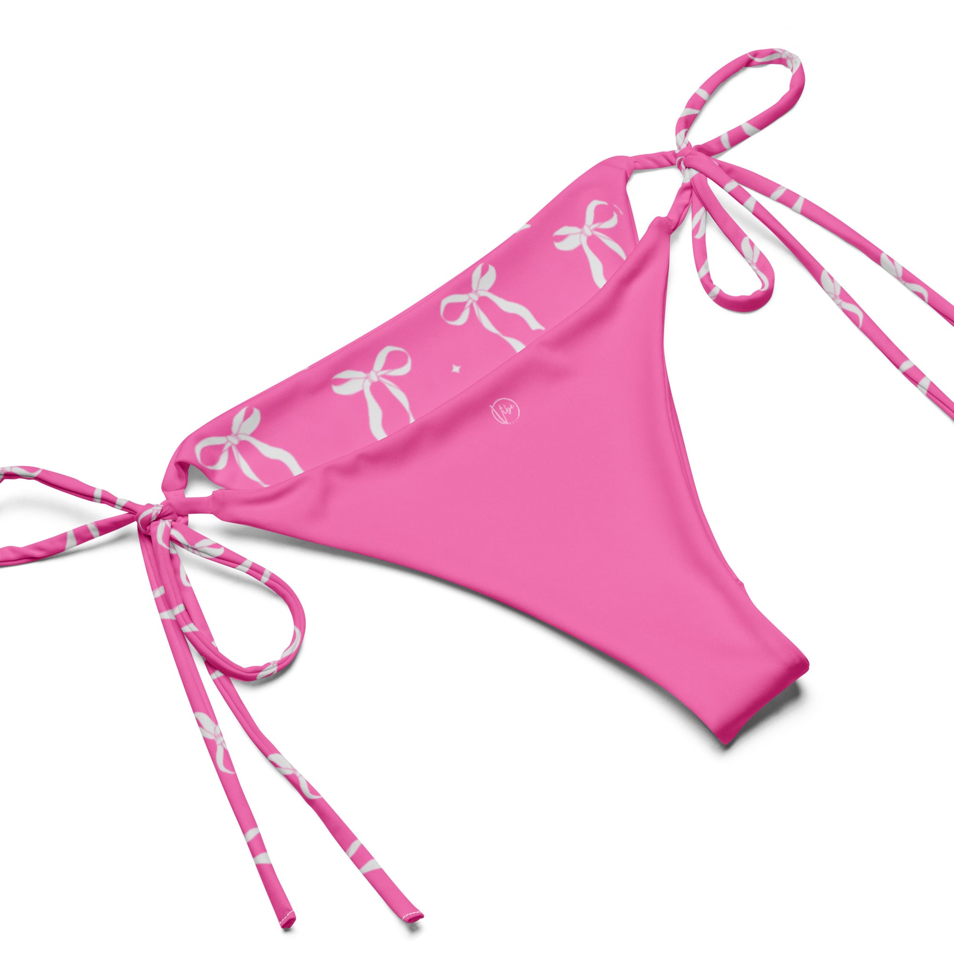 VibeWear Eco friendly pink bikini with bow pattern laid flat