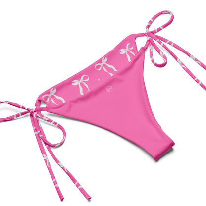 VibeWear Eco friendly pink bikini with bow pattern laid flat