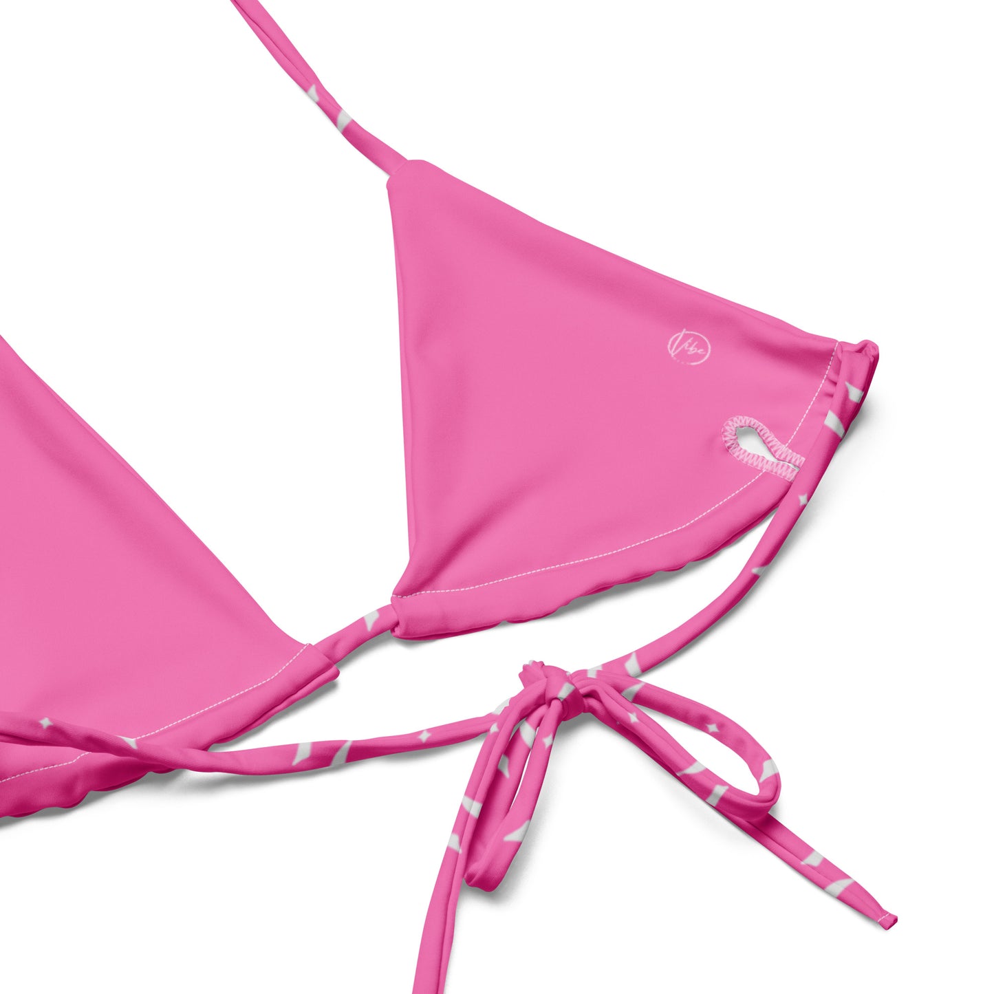 VibeWear Eco friendly pink bikini with bow pattern laid flat
