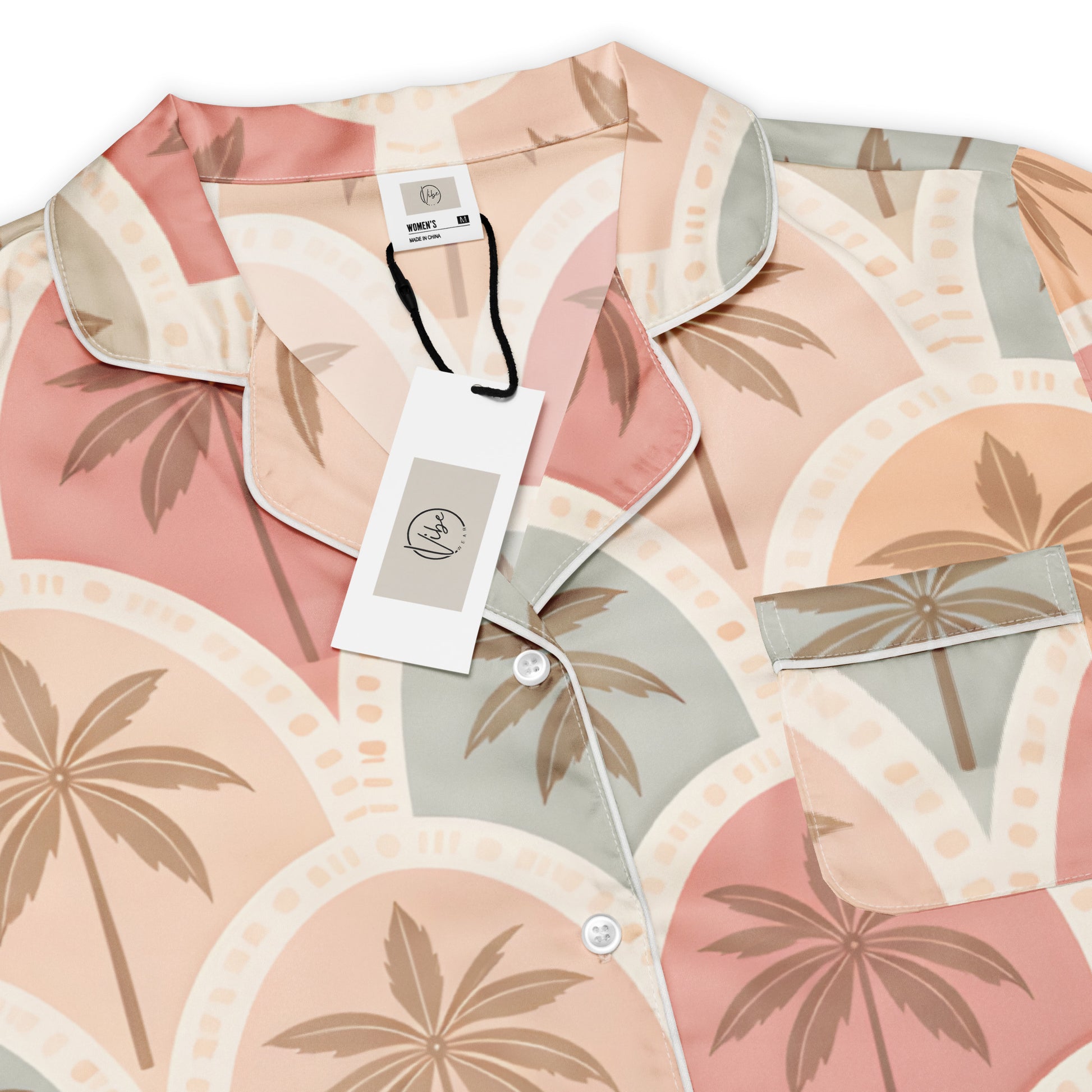 Front view Vibewear 'Sunset Palm Mosaic' long sleeve satin pajama top, showing the intricate blue and orange pattern and button-front style.