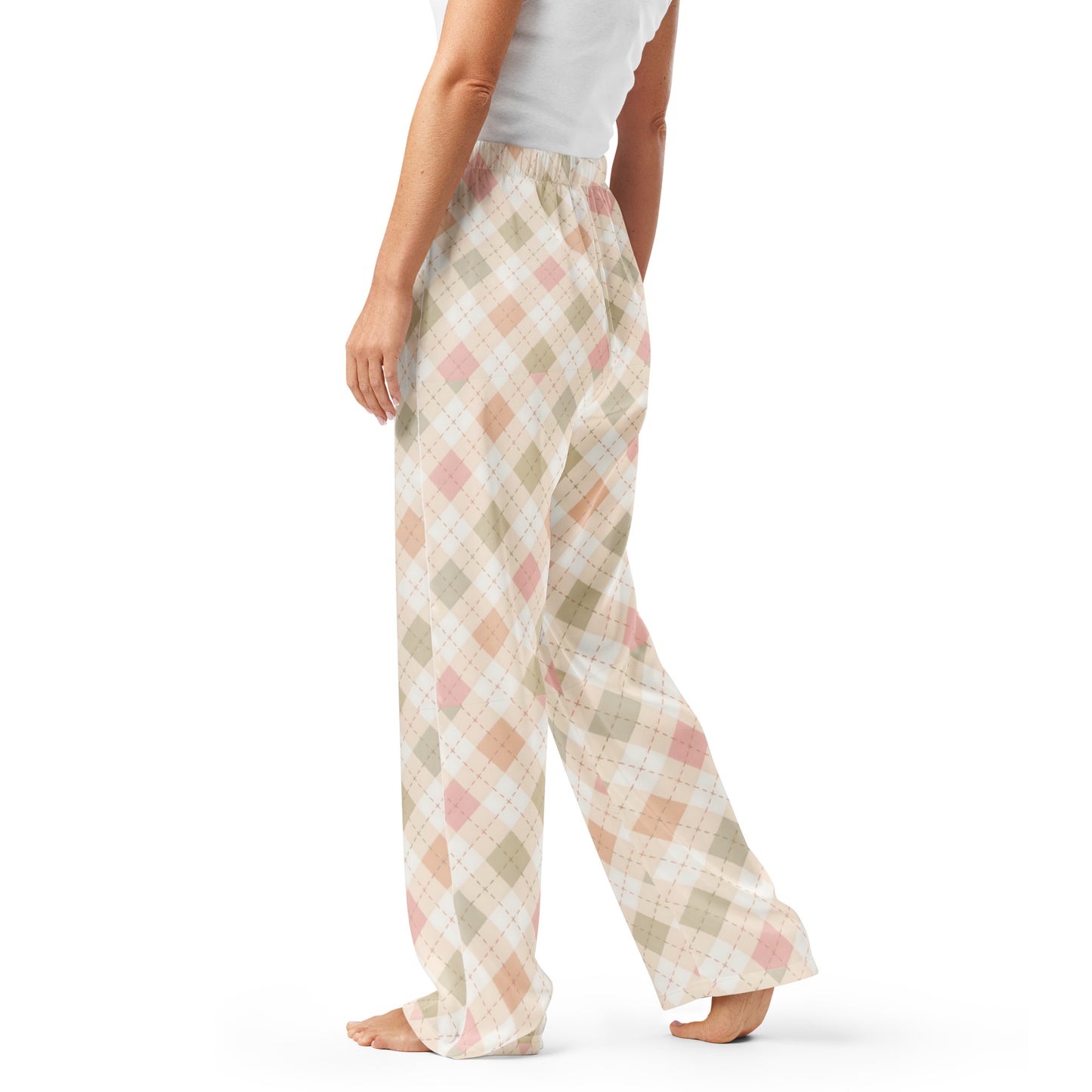 Woman wearing the Vibewear 'Blush Cottage Argyle' satin pajama pants, highlighting the pink argyle pattern and the relaxed, straight-leg fit.