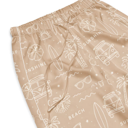 Woman wearing the 'Coastal Daydream' satin pajama pants, highlighting ocean pattern and the relaxed, straight-leg fit.