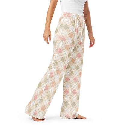Woman wearing the Vibewear 'Blush Cottage Argyle' satin pajama pants, highlighting the pink argyle pattern and the relaxed, straight-leg fit.