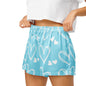 Close up of model wearing Sweetheart Skies womens pajama shorts showing elastic waistband and heart print