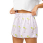 Close up of model wearing Summer Spritz Martini womens pajama shorts showing elastic waistband and martini print