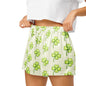 Close up of model wearing Lucky Clover Comfort womens pajama shorts showing elastic waistband and clover print