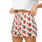 Close up of model wearing Berry Blush Bliss womens pajama shorts showing elastic waistband and strawberry print