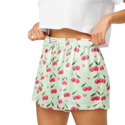 Close up of model wearing Cherry Sweet Dreams womens pajama shorts showing elastic waistband and cherry print