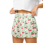 Close up of model wearing Cherry Sweet Dreams womens pajama shorts showing elastic waistband and cherry print