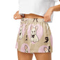 Close up of model wearing Frenchie Love womens pajama shorts showing elastic waistband and French bulldog print