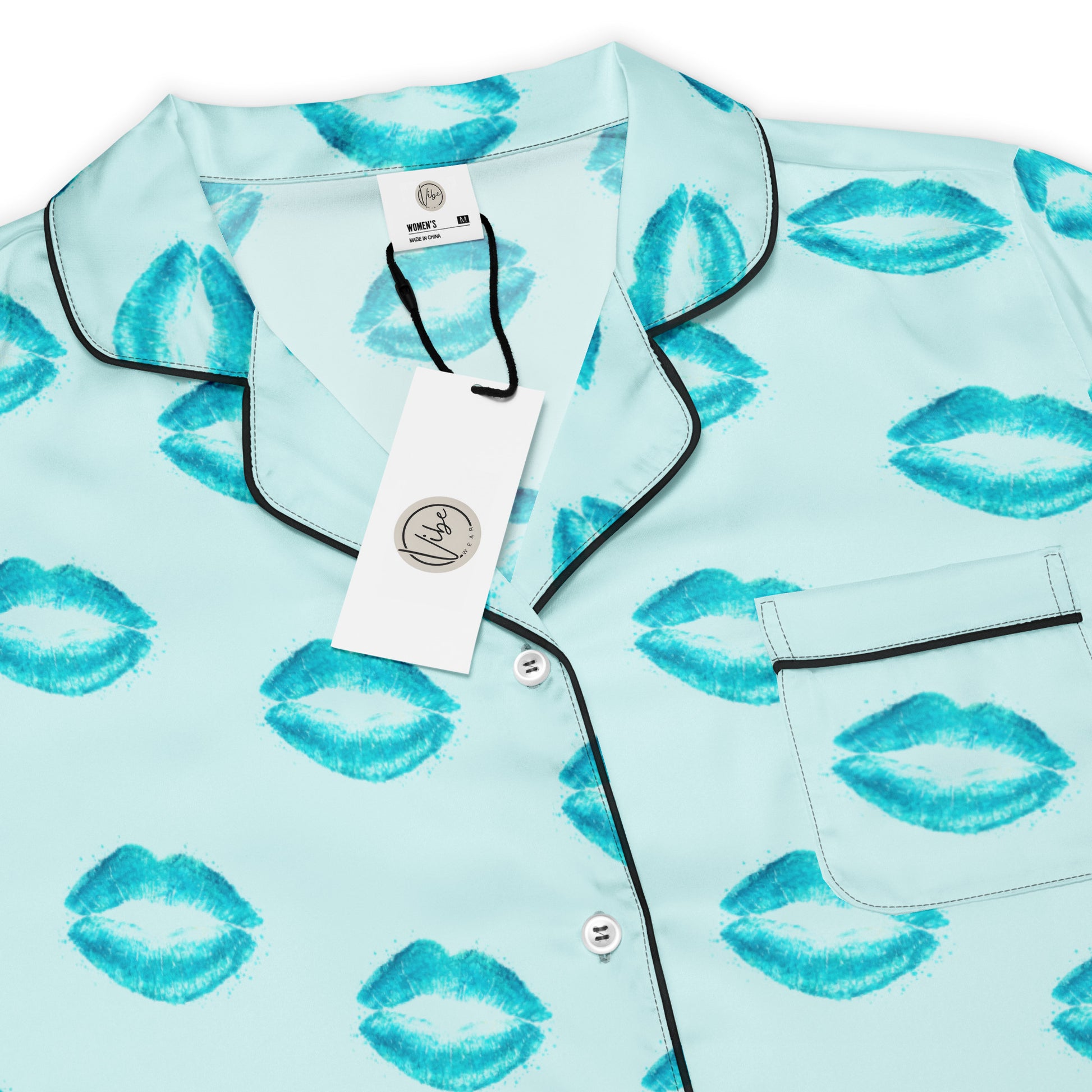 Close up of Ocean Kiss womens short sleeve pajama top fabric with blue lip pattern