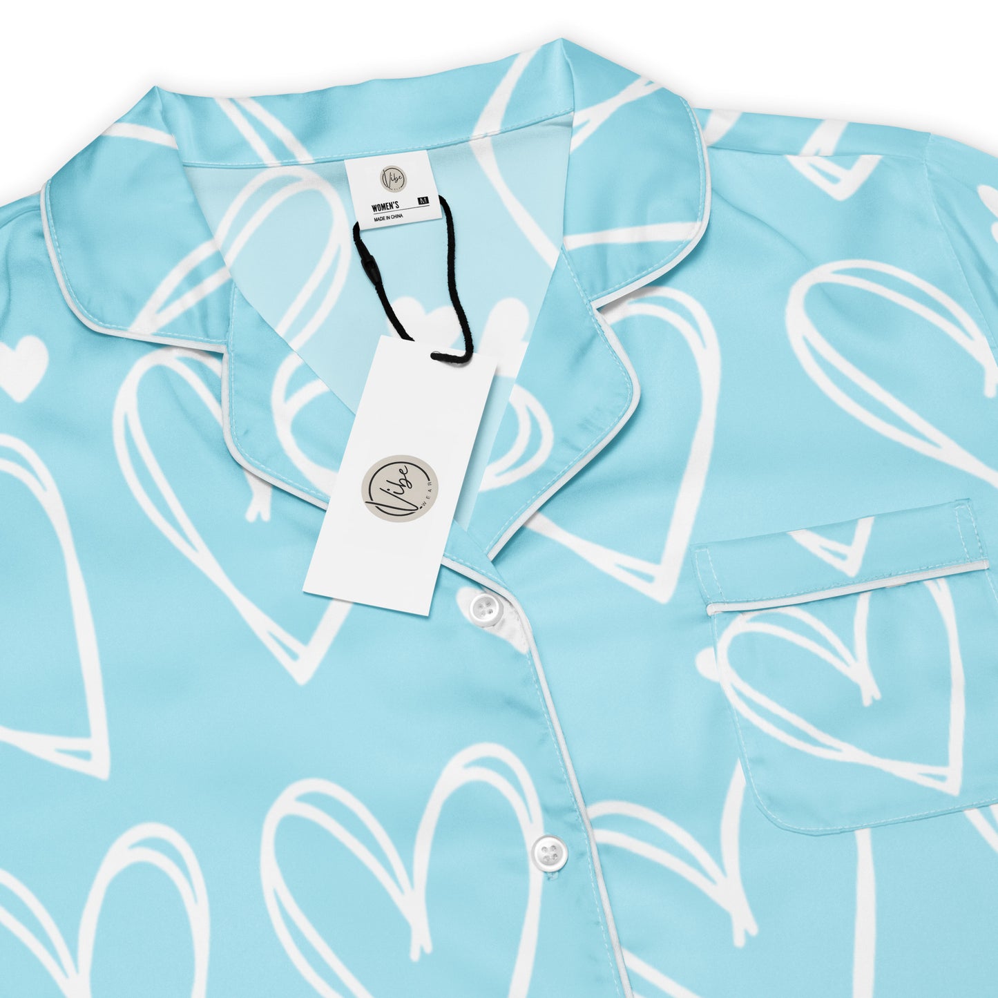 Sweetheart Skies womens short sleeve pajama top showing blue heart pattern and button front