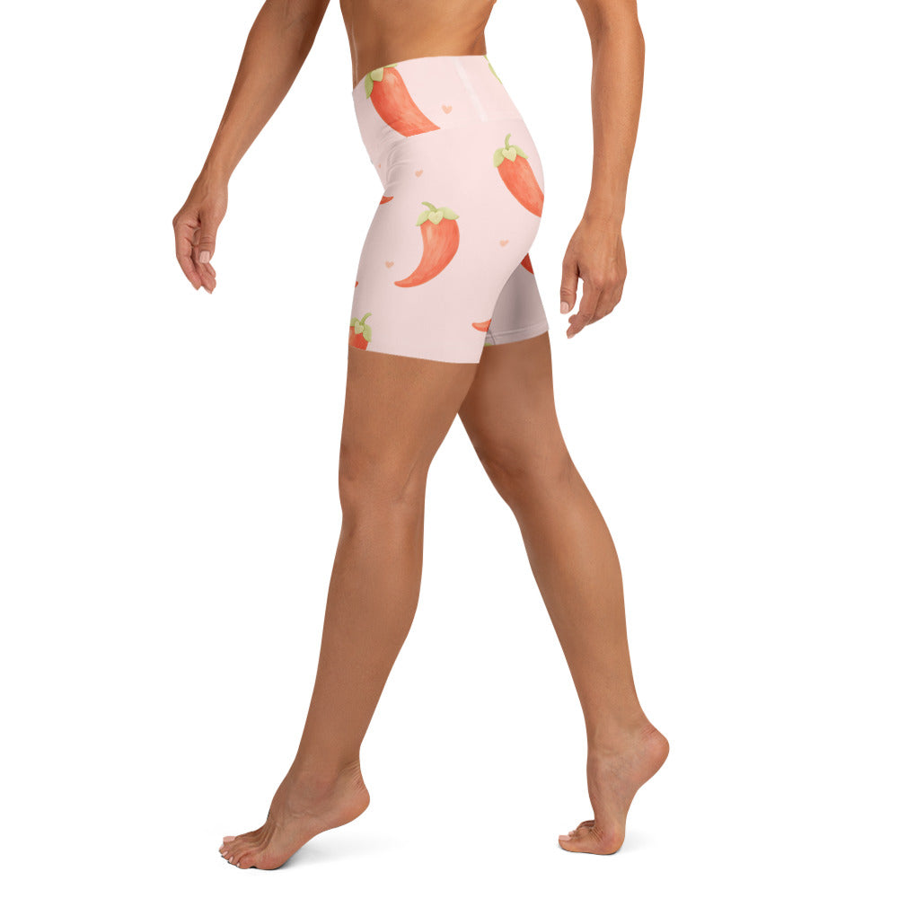 Side view of model wearing Keep It Spicy yoga shorts with chilli pepper print