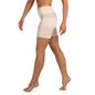 Side view of model wearing Focused high waist yoga shorts in neutral tone