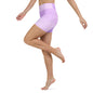 Side view of model wearing Do It For You yoga shorts in purple showing stretch and movement