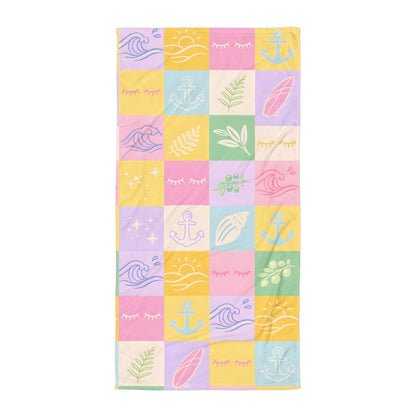 Pastel patchwork bath towel with soft colourful square pattern