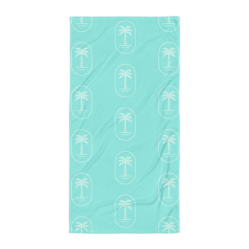 The 'Aqua Palms' towel, displaying the vibrant aqua-blue palm tree pattern