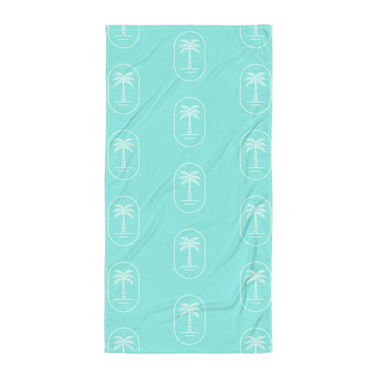 The 'Aqua Palms' towel, displaying the vibrant aqua-blue palm tree pattern