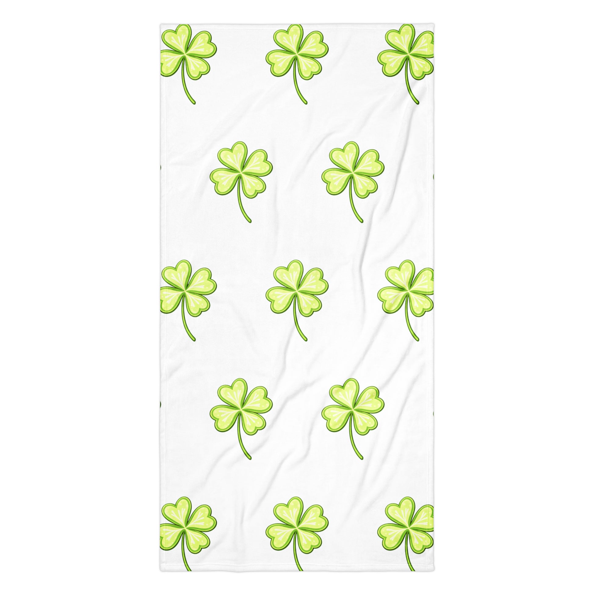Lucky Clover bath or beach towel with four leaf clover print flat lay view