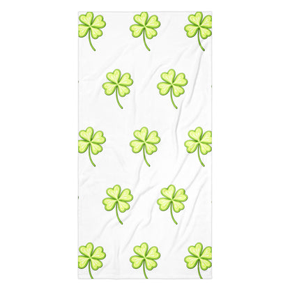 Lucky Clover bath or beach towel with four leaf clover print flat lay view
