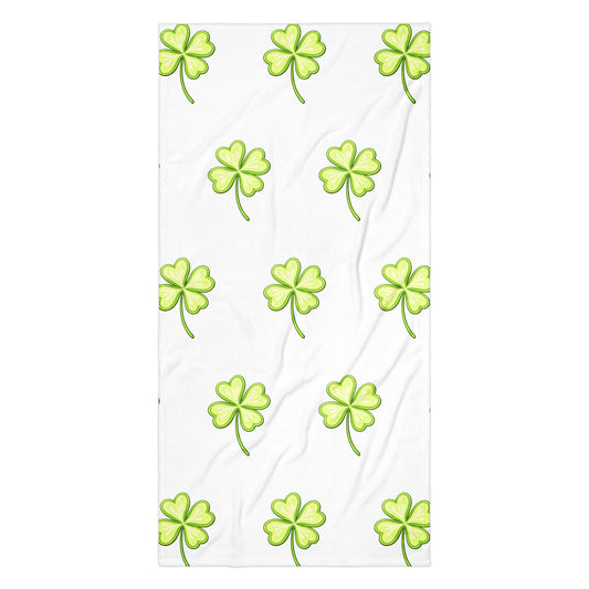 Lucky Clover bath or beach towel with four leaf clover print flat lay view