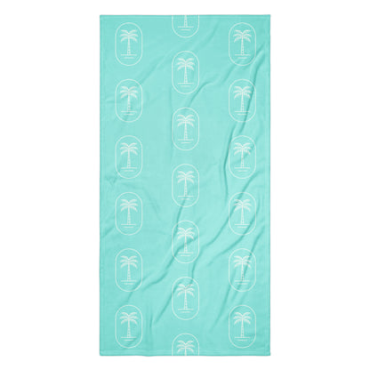 The 'Aqua Palms' towel, displaying the vibrant aqua-blue palm tree pattern