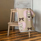 Frenchie Love bath or beach towel with French Bulldog print draped over chair