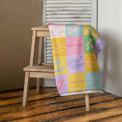 Pastel patchwork bath towel with soft colourful square pattern