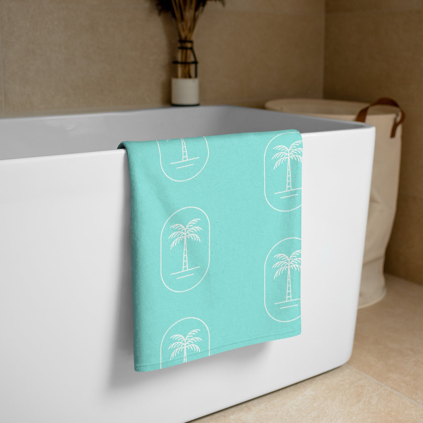 The 'Aqua Palms' towel, displaying the vibrant aqua-blue palm tree pattern