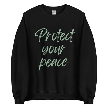 The 'Protect Your Peace' classic sweatshirt shown in black, with the slogan printed in a green retro-style font 