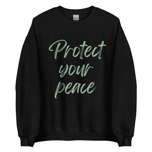 The 'Protect Your Peace' classic sweatshirt shown in black, with the slogan printed in a green retro-style font 