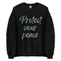 The 'Protect Your Peace' classic sweatshirt shown in black, with the slogan printed in a green retro-style font 