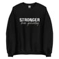 The 'Stronger Than Yesterday' classic sweatshirt shown in black, with the motivational slogan printed in a bold, white, distressed font across the chest.