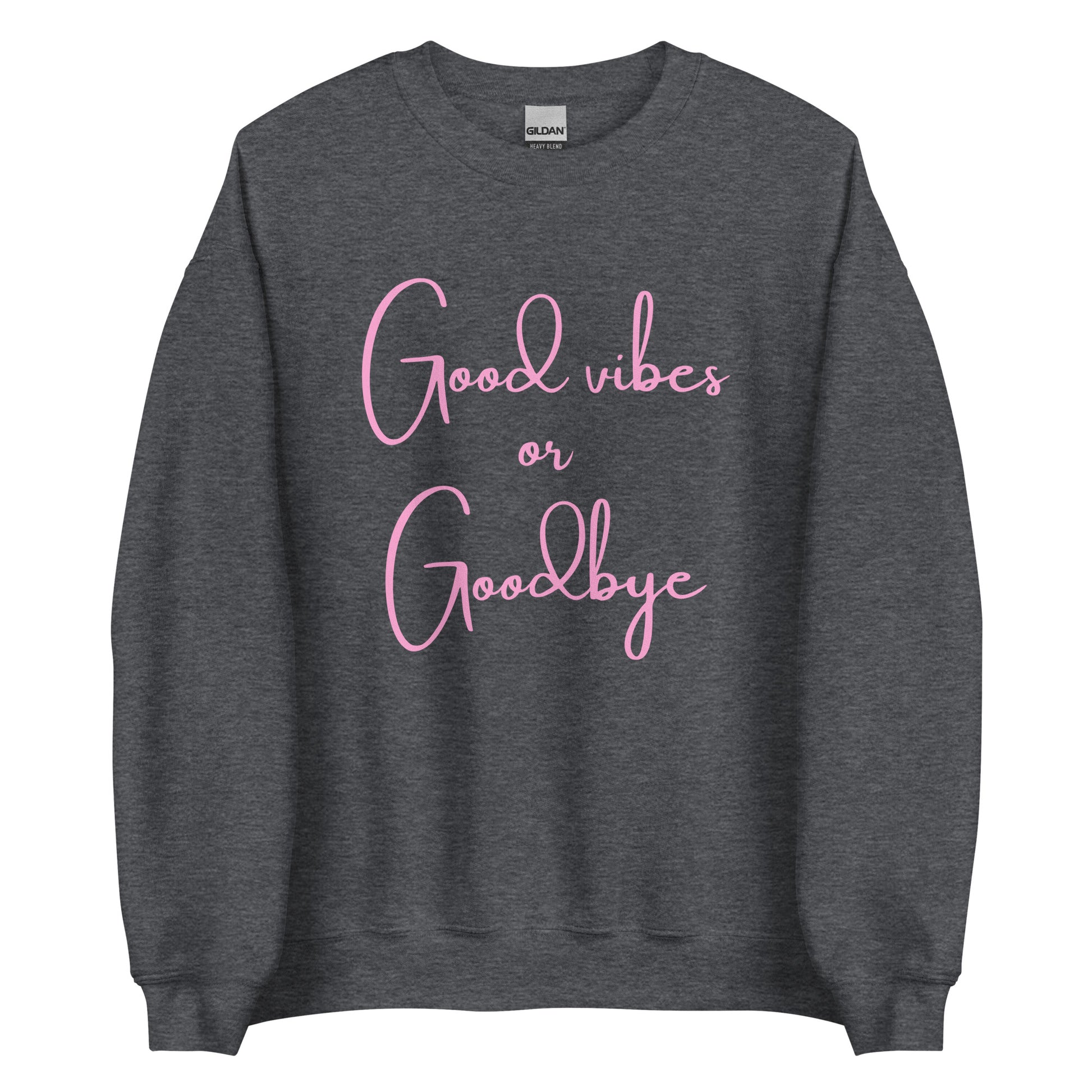 The 'Good Vibes or Goodbye' classic sweatshirt shown in dark grey, with the bold slogan printed in a pink retro-style font across the chest.