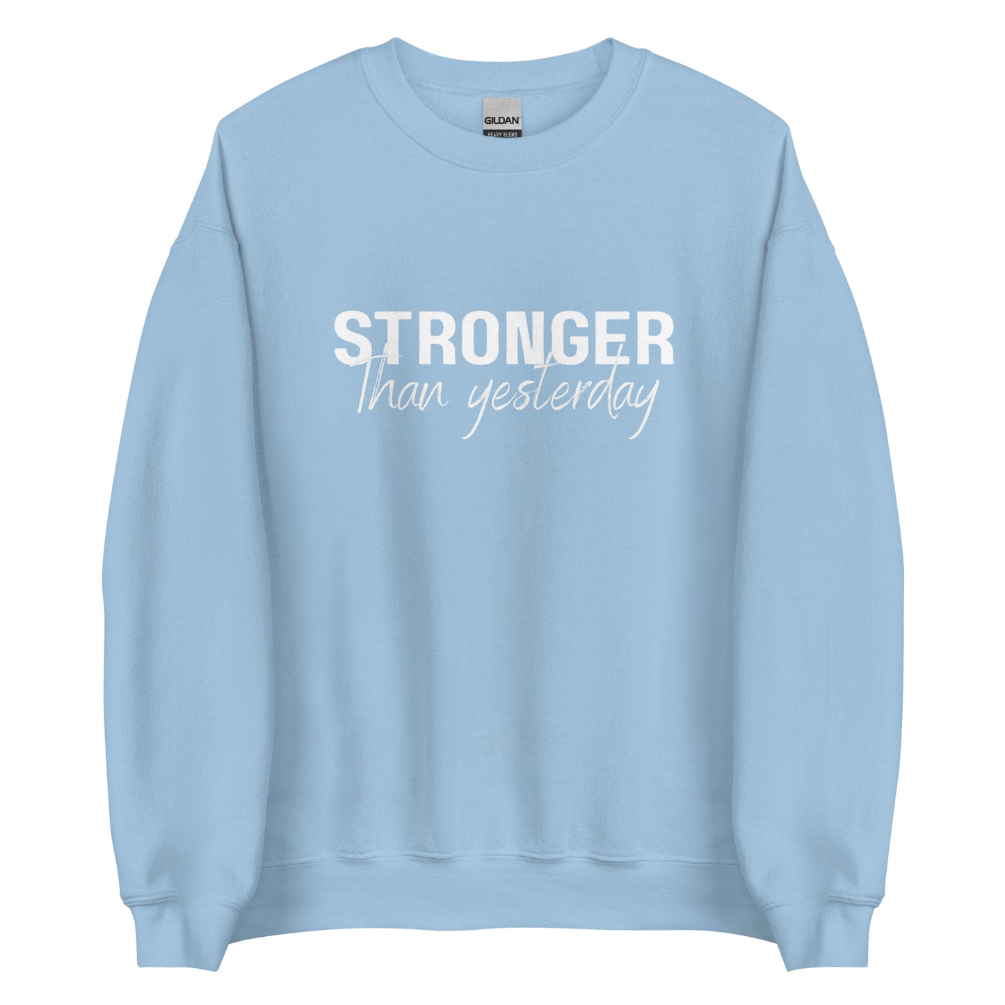 The 'Stronger Than Yesterday' classic sweatshirt shown in light blue, with the motivational slogan printed in a bold, white, distressed font across the chest.