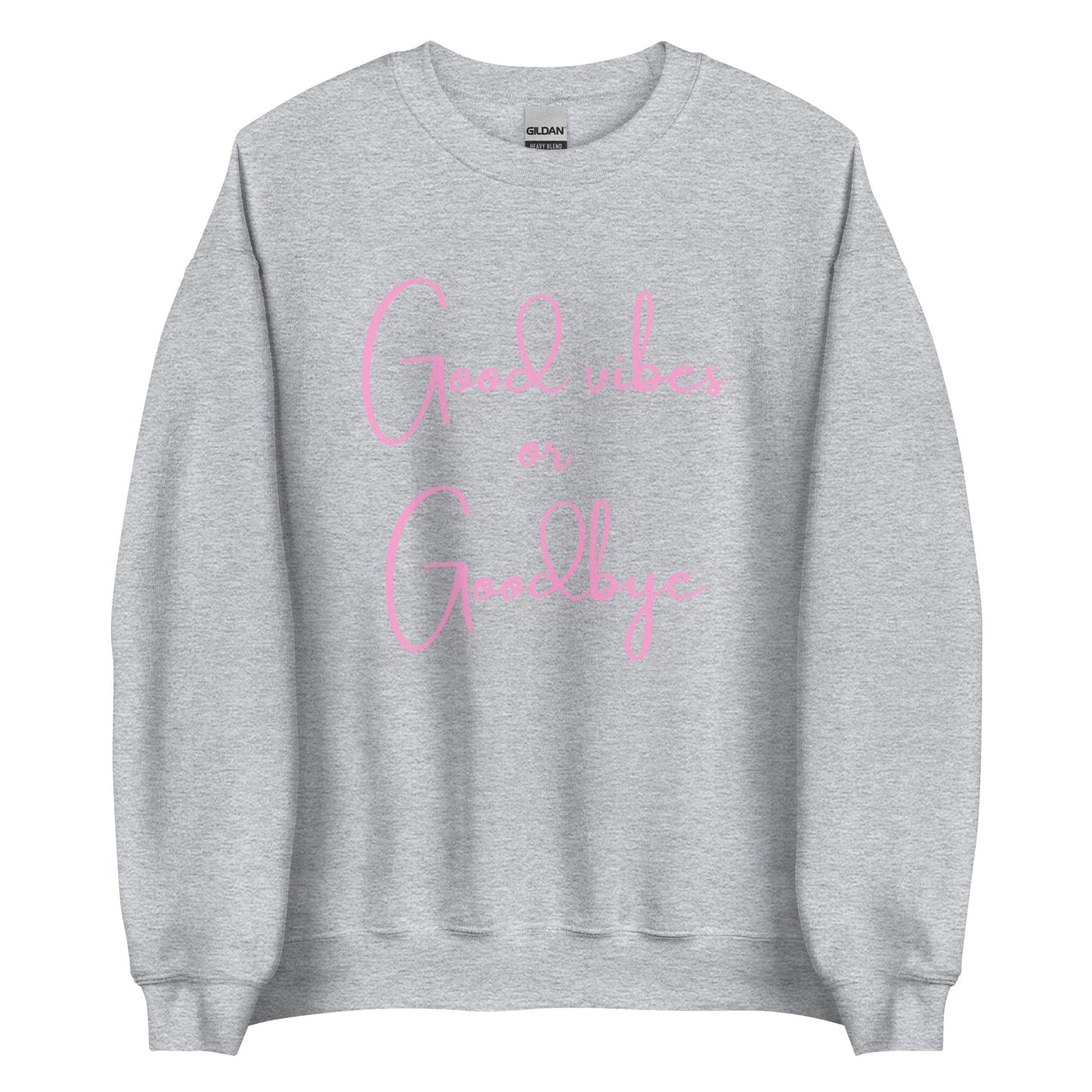 The 'Good Vibes or Goodbye' classic sweatshirt shown in light grey, with the bold slogan printed in a pink retro-style font across the chest.