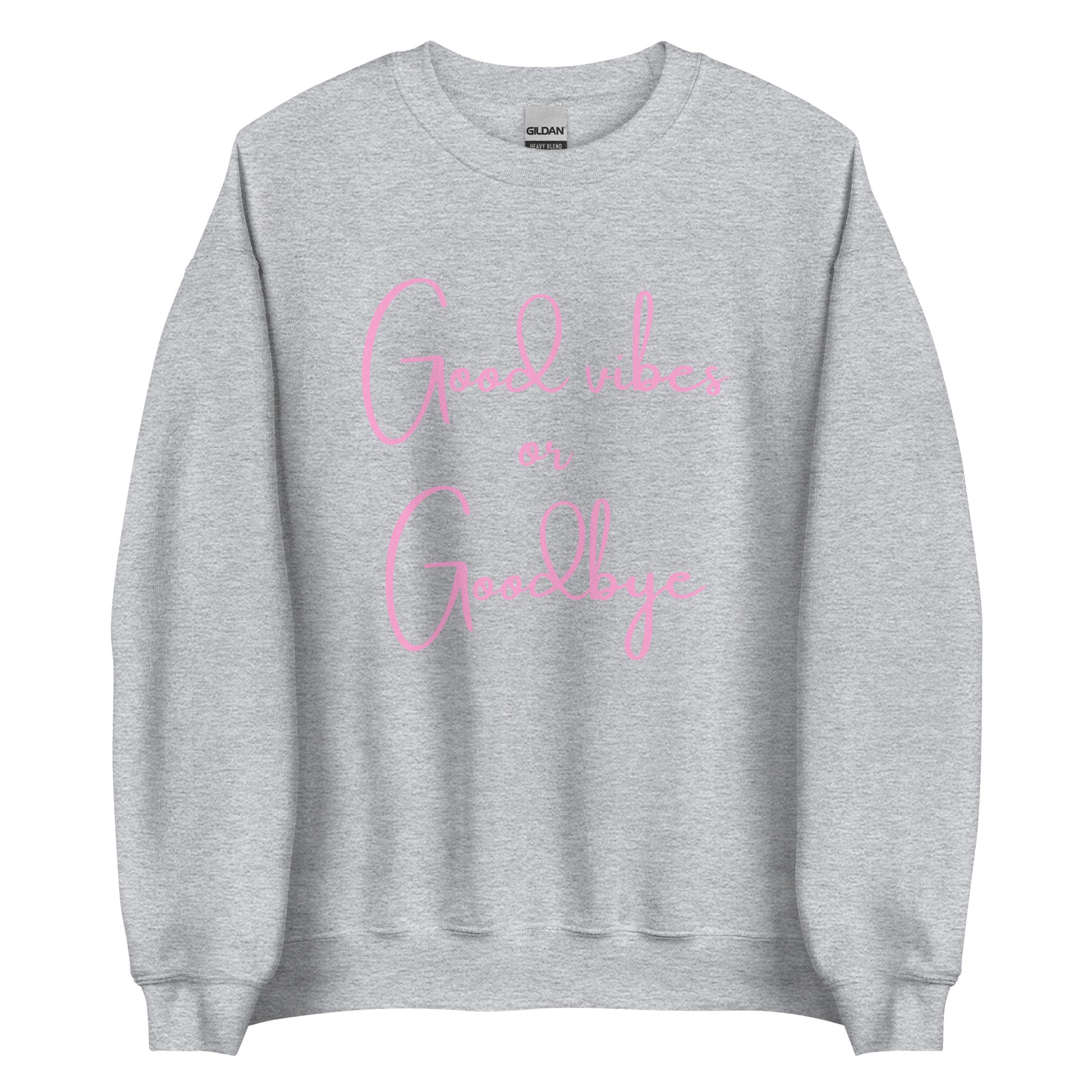 The 'Good Vibes or Goodbye' classic sweatshirt shown in light grey, with the bold slogan printed in a pink retro-style font across the chest.